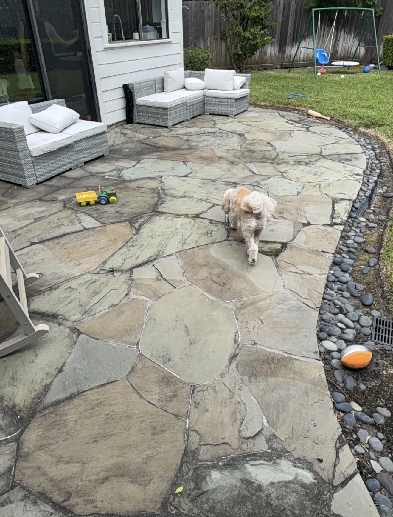 Flagstone patio in Houston, TX before deep cleaning