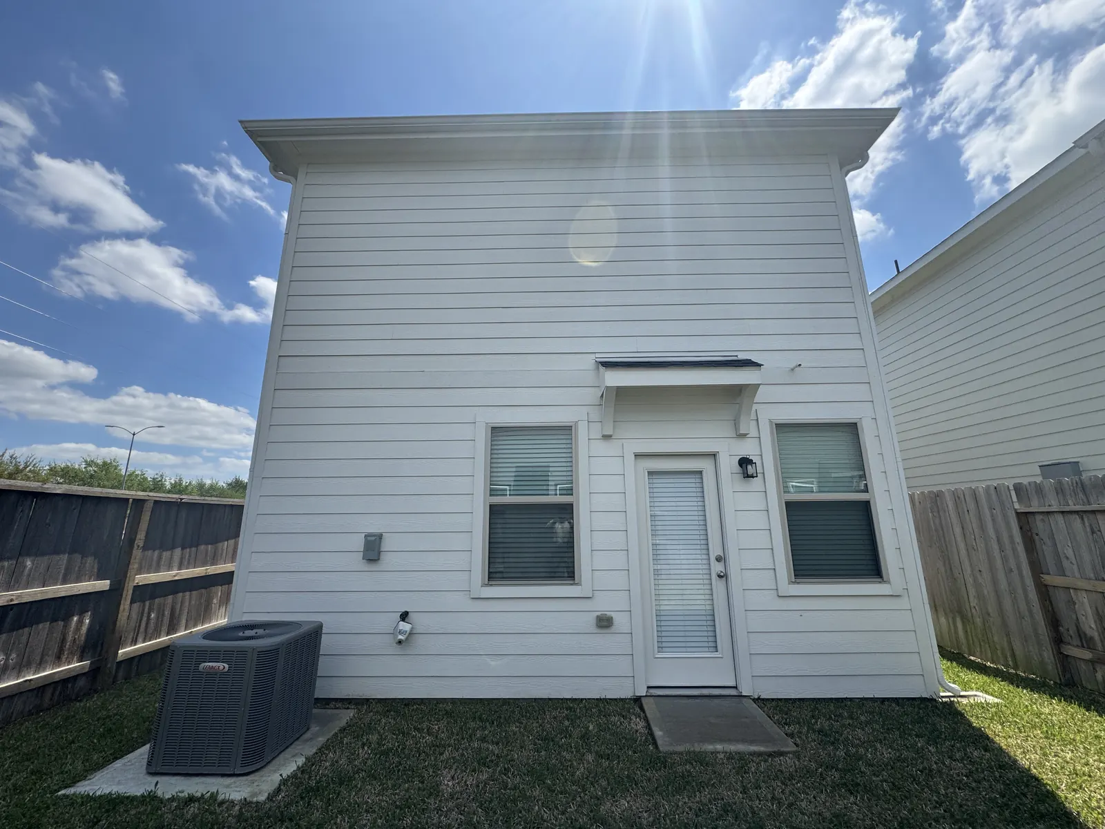 Bright white clean siding on the same Houston, TX home after soft washing